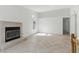 Cozy living area with tile flooring, a fireplace, and a bright window at 9116 Cypress Point Way, Las Vegas, NV 89117