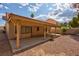 Spacious covered patio extends onto a low-maintenance gravel backyard with mature landscaping at 9116 Cypress Point Way, Las Vegas, NV 89117