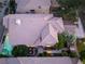 An aerial view shows a tile roof, backyard landscaping, and a swimming pool with attached hot tub at 912 Pro Players Dr, Las Vegas, NV 89134
