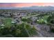 An aerial view shows this golf course community and the mountain range at 912 Pro Players Dr, Las Vegas, NV 89134