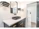 Modern bathroom showcasing a black vanity with white countertops and decorative lighting at 912 Pro Players Dr, Las Vegas, NV 89134