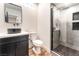 Modern bathroom featuring a walk-in shower, stylish vanity, and sleek black fixtures at 912 Pro Players Dr, Las Vegas, NV 89134
