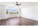 Spacious bedroom with large windows offering abundant natural light with hardwood style floors at 912 Pro Players Dr, Las Vegas, NV 89134