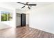 Bright bedroom featuring dark wood flooring and a ceiling fan at 912 Pro Players Dr, Las Vegas, NV 89134