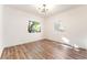 Bright bedroom with hardwood floors and dual windows providing ample natural light at 912 Pro Players Dr, Las Vegas, NV 89134