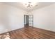Bedroom with hardwood floors, a modern light fixture, and a stylish interior door at 912 Pro Players Dr, Las Vegas, NV 89134