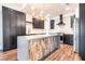 Beautiful kitchen island with a modern design and black cabinets, with stainless steel appliances at 912 Pro Players Dr, Las Vegas, NV 89134
