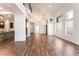 Bright open living room with vaulted ceilings, hardwood floors, fireplace, and kitchen view at 912 Pro Players Dr, Las Vegas, NV 89134
