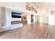 Open living area with hardwood floors, fireplace, and view of the kitchen at 912 Pro Players Dr, Las Vegas, NV 89134