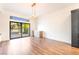 Light-filled living room featuring sliding glass doors, patio access, and modern lighting at 912 Pro Players Dr, Las Vegas, NV 89134