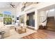 Tastefully furnished living room with hardwood floors, fireplace, and natural light at 912 Pro Players Dr, Las Vegas, NV 89134