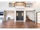 Spacious living room with hardwood floors, modern fireplace, and staircase to upper level at 912 Pro Players Dr, Las Vegas, NV 89134