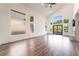 Bright and airy living room with hardwood floors, large windows, and modern fireplace at 912 Pro Players Dr, Las Vegas, NV 89134