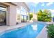 This backyard pool and spa features views of the home's architecture with its abundance of large windows at 912 Pro Players Dr, Las Vegas, NV 89134
