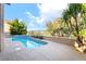 Inviting backyard pool with concrete decking and lush landscaping offers the perfect spot to relax at 912 Pro Players Dr, Las Vegas, NV 89134