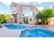 Backyard featuring a pool and patio, with mature trees and landscaping at 912 Pro Players Dr, Las Vegas, NV 89134