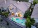 Charming home with a private backyard featuring a unique geometric pool and a well-manicured garden at 912 Pro Players Dr, Las Vegas, NV 89134