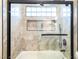 Close up on new shower featuring glass enclosure, niche, and stone tile at 912 Pro Players Dr, Las Vegas, NV 89134