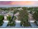 Attractive homes with well-maintained lawns and mature trees line a quiet neighborhood street at 912 Pro Players Dr, Las Vegas, NV 89134