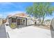 Spacious backyard featuring a covered patio, stucco wall, and a barbecue for outdoor living at 9151 Indian Breeze Dr, Las Vegas, NV 89129
