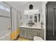 Well-lit bathroom features a double sink vanity, and a shower/tub combination with stylish finishes at 9151 Indian Breeze Dr, Las Vegas, NV 89129