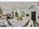 Bright dining area boasts stylish furnishings, modern lighting, and open access to the kitchen at 9151 Indian Breeze Dr, Las Vegas, NV 89129