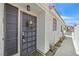 Inviting front entrance with a secure metal screen door and desert-friendly landscaping at 9151 Indian Breeze Dr, Las Vegas, NV 89129