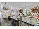 Bright kitchen featuring white cabinets, butcher block countertops, open shelving and stainless steel appliances at 9151 Indian Breeze Dr, Las Vegas, NV 89129
