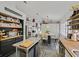 Bright and modern kitchen with island, open shelving, butcher block counters, and stainless appliances at 9151 Indian Breeze Dr, Las Vegas, NV 89129