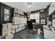 Office with built-in shelves, black walls and lots of natural light at 9151 Indian Breeze Dr, Las Vegas, NV 89129