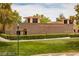 Exterior view of 'The Trails Community Center' with well-maintained landscaping and a welcoming facade at 9728 Echo Hills Dr, Las Vegas, NV 89134