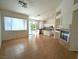 Open-concept living space boasts tile floors, fireplace, and abundant natural light at 9728 Echo Hills Dr, Las Vegas, NV 89134