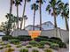 The La Paz community sign is surrounded by mature landscaping and palm trees at 9728 Echo Hills Dr, Las Vegas, NV 89134