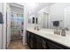 This bathroom features dual sinks, sleek fixtures, and ample counter space, perfect for a modern lifestyle at 10526 Harvest Wind Dr, Las Vegas, NV 89135