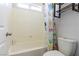 This bathroom showcases a tub-shower with neutral-toned walls and playful decorative shower curtain at 10526 Harvest Wind Dr, Las Vegas, NV 89135