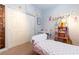 A bright bedroom enhanced by personalized decor and a functional desk for study and play at 10526 Harvest Wind Dr, Las Vegas, NV 89135