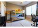 This bedroom is a haven of imagination, featuring bunk beds and a space designed for relaxation and creativity at 10526 Harvest Wind Dr, Las Vegas, NV 89135