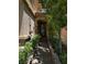 Charming home entrance with manicured landscaping and a stone-paved walkway to the front door at 10526 Harvest Wind Dr, Las Vegas, NV 89135