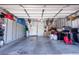 A spacious garage with built in storage cabinets and overhead storage at 10526 Harvest Wind Dr, Las Vegas, NV 89135