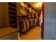 Spacious walk-in closet with built-in shelving and hanging rods for ample storage at 10526 Harvest Wind Dr, Las Vegas, NV 89135