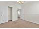 Empty bedroom with neutral walls and carpet, and standard closet with sliding doors at 10987 Santorini Dr, Las Vegas, NV 89141