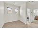 Empty bedroom with neutral walls, carpet, and views to laundry and bathroom at 10987 Santorini Dr, Las Vegas, NV 89141