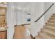 Inviting entryway with tiled floor, staircase, and easy access to the bathroom at 10987 Santorini Dr, Las Vegas, NV 89141