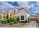 Two-story home with a tile roof and attached garage at 10987 Santorini Dr, Las Vegas, NV 89141