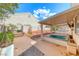 Backyard featuring a hot tub and well-maintained landscaping at 1126 Winter Storm Dr, Henderson, NV 89052