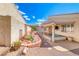 Backyard featuring a hot tub, covered patio, and curated landscaping at 1126 Winter Storm Dr, Henderson, NV 89052