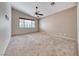 Bedroom boasts natural light from a window and features neutral carpet flooring at 1126 Winter Storm Dr, Henderson, NV 89052