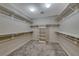Walk-in closet features built-in shelving and carpet flooring at 1126 Winter Storm Dr, Henderson, NV 89052