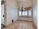Dining area features neutral tones, decorative light fixture, and outdoor access at 1126 Winter Storm Dr, Henderson, NV 89052