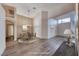 Inviting dining area with chandelier, with wood-look flooring and neutral walls at 1126 Winter Storm Dr, Henderson, NV 89052